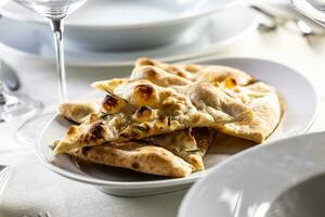 Italian dry pizza dough baked and sliced as a crunchy side dish in a restaurant photo