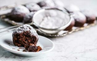 Homemade bakery and sweet muffins with powdered sugar photo