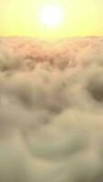 Sunrise sun over thick clouds. infinite loop vertical video