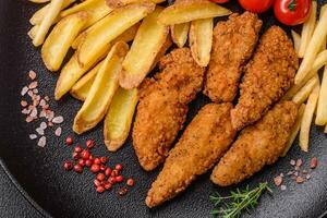 Delicious crispy chicken nuggets breaded with salt and spices photo