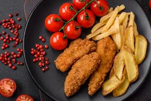 Delicious crispy chicken nuggets breaded with salt and spices photo