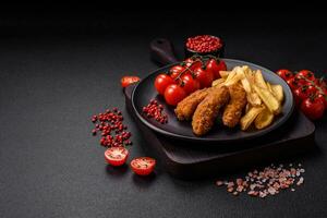 Delicious crispy chicken nuggets breaded with salt and spices photo