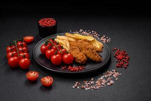 Delicious crispy chicken nuggets breaded with salt and spices photo