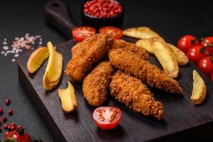 Delicious crispy chicken nuggets breaded with salt and spices photo