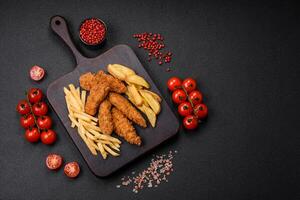 Delicious crispy chicken nuggets breaded with salt and spices photo