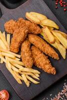 Delicious crispy chicken nuggets breaded with salt and spices photo