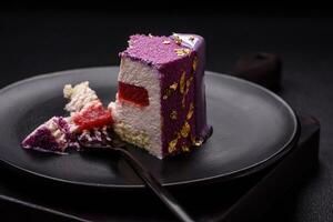 Delicious fresh sweet mousse cake with berry filling photo