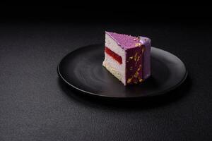 Delicious fresh sweet mousse cake with berry filling photo