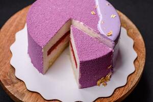 Delicious fresh sweet mousse cake with berry filling photo