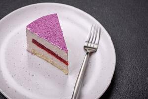 Delicious fresh sweet mousse cake with berry filling photo