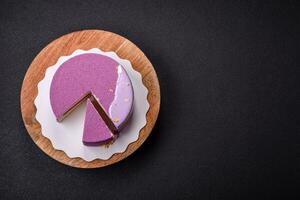 Delicious fresh sweet mousse cake with berry filling photo