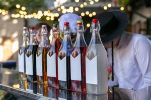 Aromatic custom wines, liqueurs, tincture and spirits in elegant bottles photo