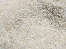 Close up of uncooked white rice grains photo