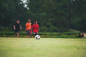 Kids playing soccer football photo