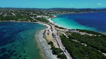 Aerial view of isthmus of sea with road and beach in Sardinia video