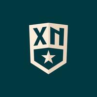 Initial XN logo star shield symbol with simple design vector