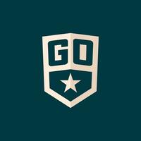 Initial GO logo star shield symbol with simple design vector