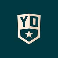 Initial YO logo star shield symbol with simple design vector