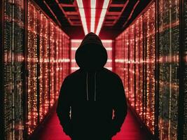 photo of man in black hoodie in server data center room with neon light, generative AI