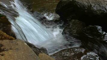 The view of the waterfall with rocks and clear water video