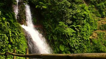 The view of the waterfall with rocks and clear water video