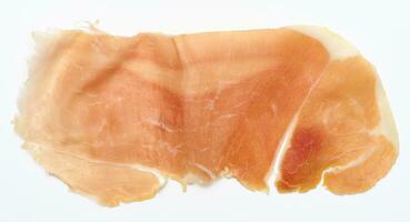 Thin piece of jamon on a white background, top view photo