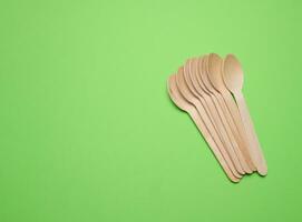 New wooden spoon, top view. Recycling materials photo