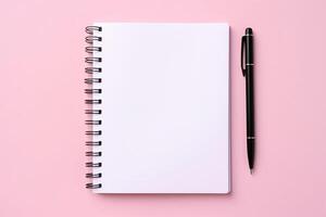 Spiral notebook with pen. photo