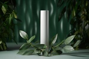 A mock-up of a tube of white cream with a lid on a background of eucalyptus leaves.. photo