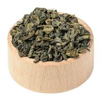 Twisted dry green tea leaves, healthy drink photo