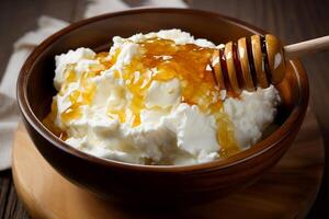 Cottage cheese in a plate with honey. photo