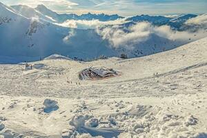 Panoramic image of a ski slope in Kanzelwand ski resort in Kleinwalsertal valley in Austria photo