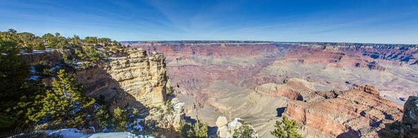 Panorama picture over Grand Canyon with blue sky in Arizona photo