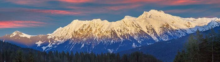 Panoramic image of mountain formation around Plattenspitze in Austria during sunset photo