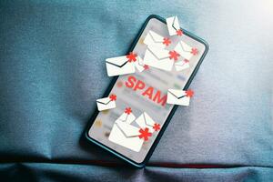 Top lay photo of smartphone with hologram mail spam concept. Communication business technology. Protect spam mail from internet cyber security.