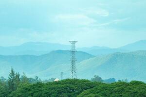 Electric power poles with power lines background photo