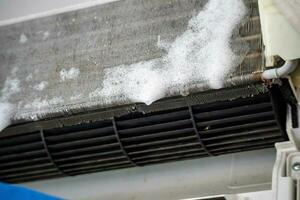 air conditioner cleaning with spray foam cleaner photo