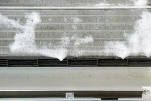 air conditioner cleaning with spray foam cleaner photo