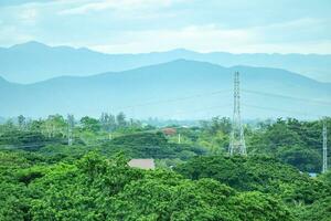 Electric power poles with power lines background photo