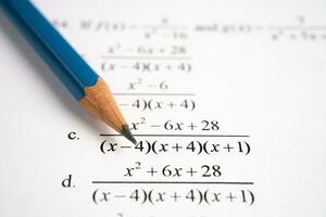 Pencil on mathematic formula exercise test paper in education school. photo