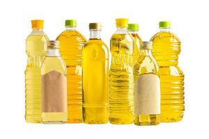 Vegetable oil with olive oil in different bottle for cooking isolated on white background with clipping path. photo