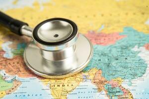 Bangkok, Thailand June 1, 2022, Stethoscope on India world globe map background. photo