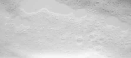 Abstract white soap foam bubbles texture background photo