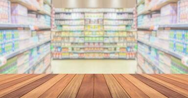 Empty wood table top with supermarket blurred background for product display photo