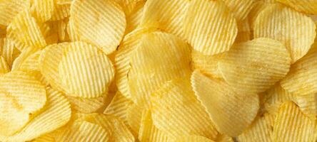 crispy golden potato chips snack texture background photo