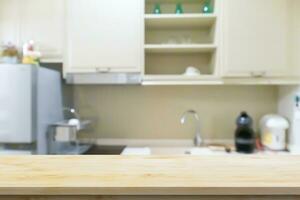 Black wood counter top with blurred kitchen background photo