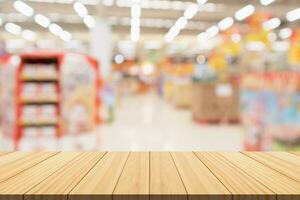 Empty wood table top with supermarket blurred background for product display photo