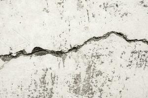 Grunge cracked concrete wall texture abstract background photo
