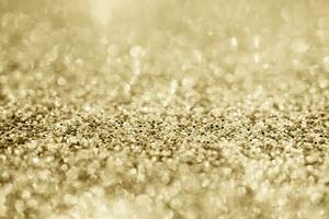 Abstract gold glitter sparkle with bokeh background photo