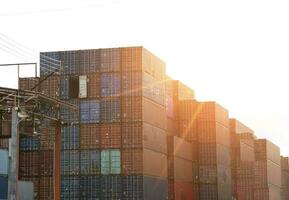 A large number of shipping containers are waiting to be transported. photo